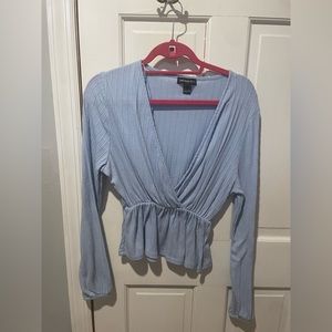 low plunge light blue shirt